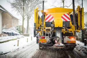 Photo of a salt truck in winter, the kind our client hit and got a reckless driving ticket in va